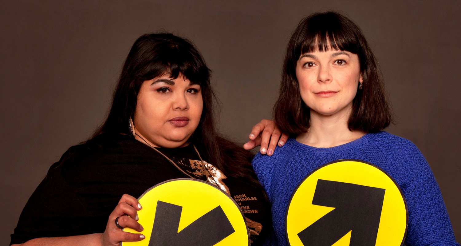 Studio headshot of Yolanda Bonnell and Natasha Greenblatt holding election signs.