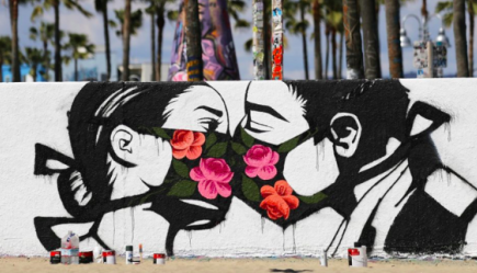 Graffiti image of couple kissing with face masks.