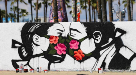 Graffiti image of couple kissing with face masks.