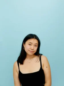 A photo of Athena So against a blue background