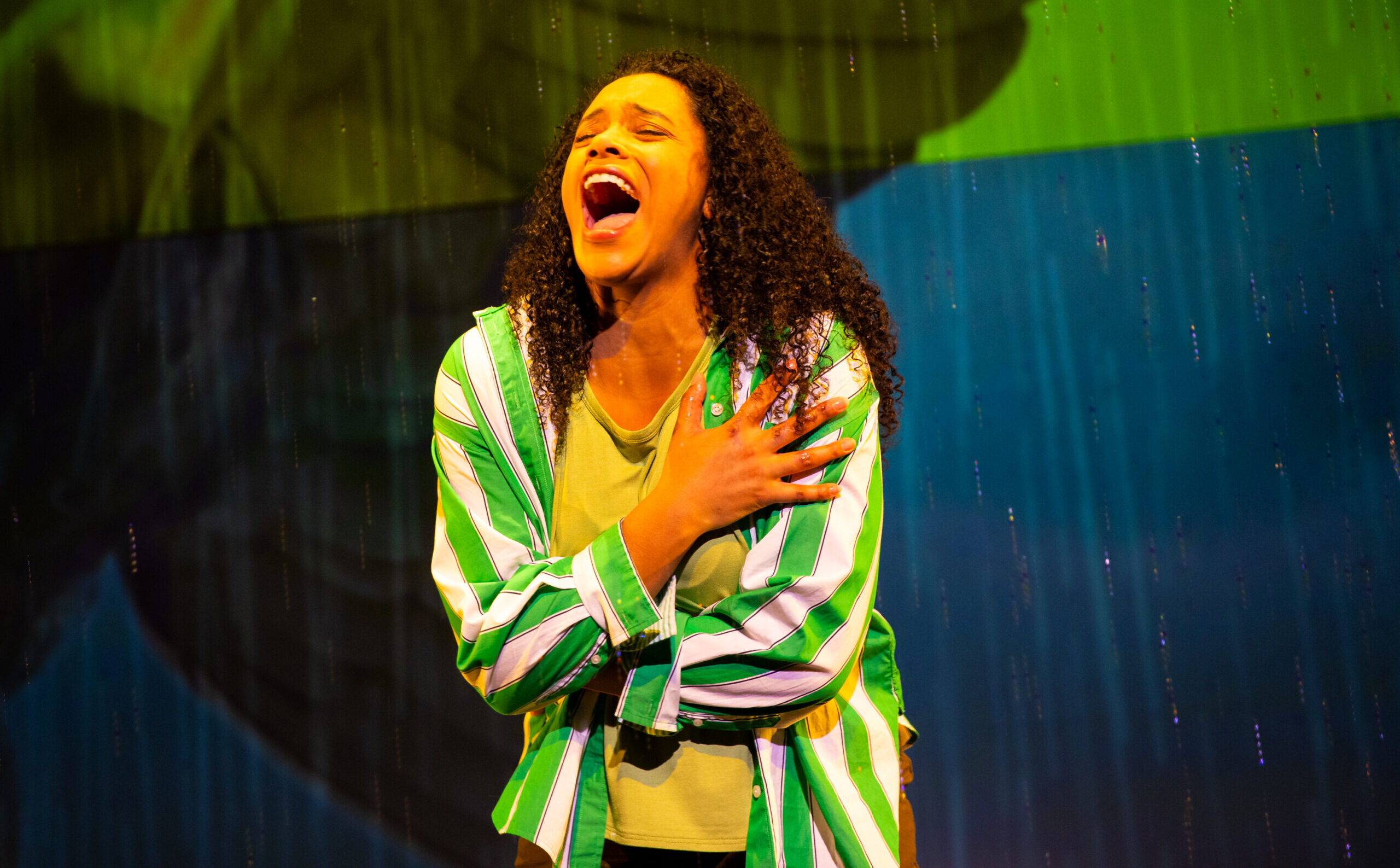 Vanessa Sears crosses her arms and screams into the rain