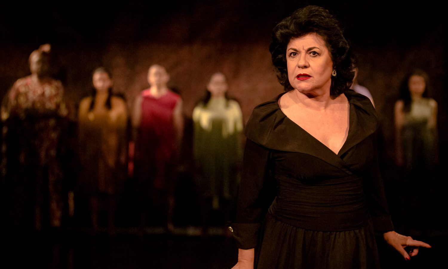 Rosalba Martinni with the ensemble in the background. Stage photo.